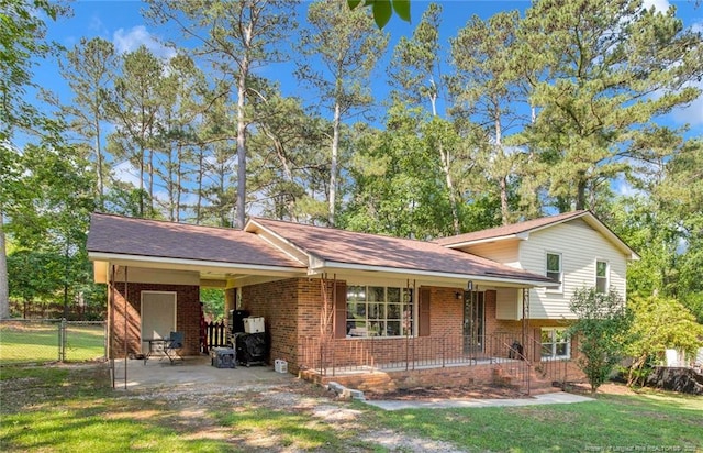 1618 Hickory Ridge Ct, Fayetteville, NC 28304 - tri-level home featuring brick siding, a porch, and an attached carport