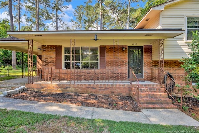 1618 Hickory Ridge Ct, Fayetteville, NC 28304 - split level home with a porch, brick siding, and an attached carport