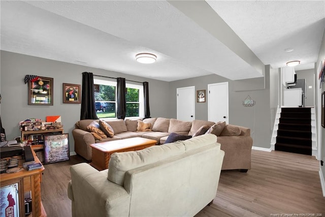 1618 Hickory Ridge Ct, Fayetteville, NC 28304 - living room with wood finished floors, baseboards, and stairs