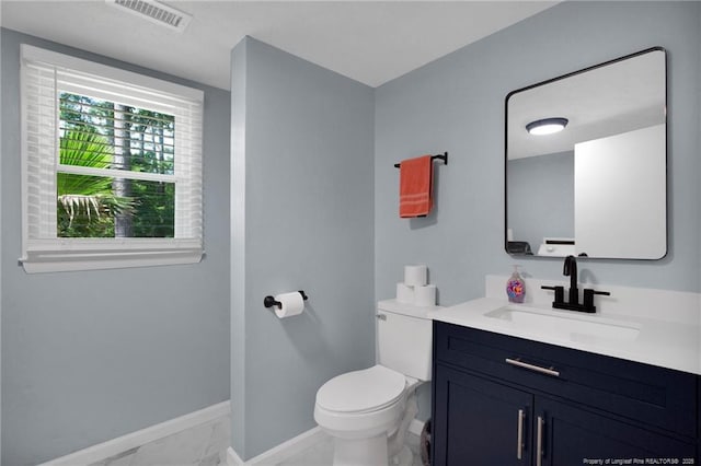 1618 Hickory Ridge Ct, Fayetteville, NC 28304 - bathroom featuring marble finish floors, toilet, baseboards, and vanity