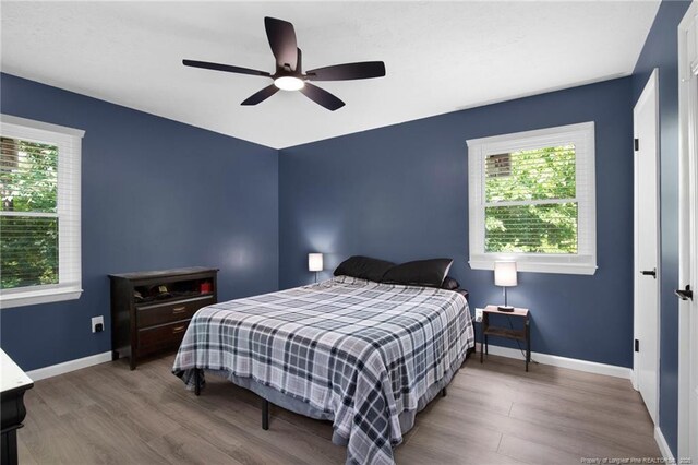 1618 Hickory Ridge Ct, Fayetteville, NC 28304 - bedroom featuring wood finished floors, baseboards, and a ceiling fan