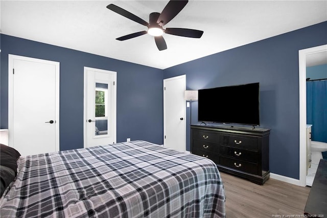 1618 Hickory Ridge Ct, Fayetteville, NC 28304 - bedroom featuring wood finished floors, baseboards, ceiling fan, and connected bathroom