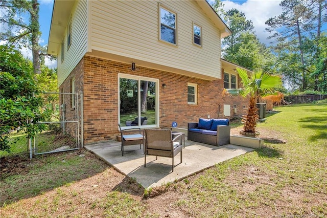1618 Hickory Ridge Ct, Fayetteville, NC 28304 - back of property featuring an outdoor hangout area, brick siding, a patio, and central AC