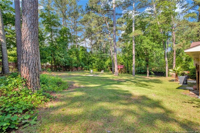 1618 Hickory Ridge Ct, Fayetteville, NC 28304 - view of green lawn with central AC