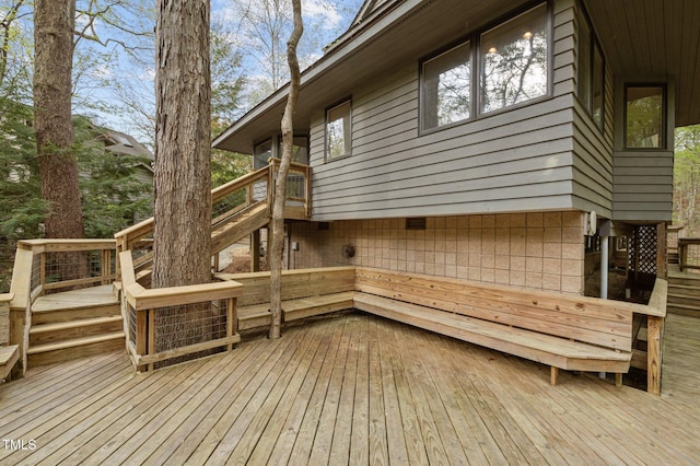 wooden terrace featuring stairs