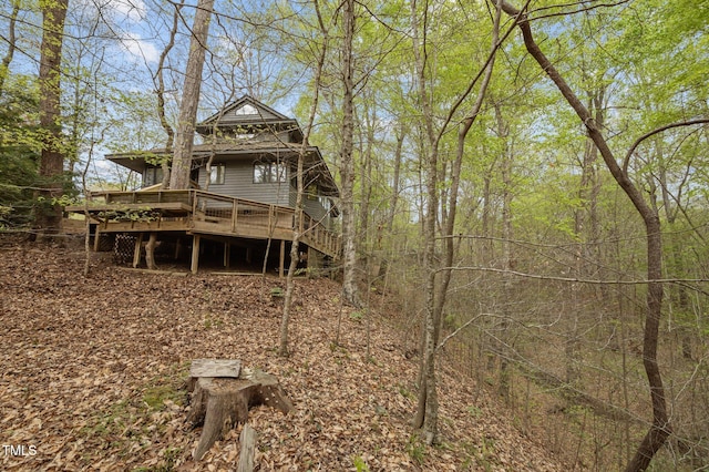 rear view of house with a deck and stairway