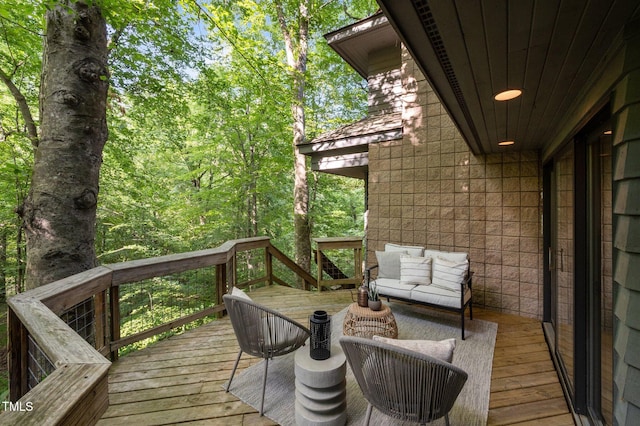 wooden terrace featuring an outdoor hangout area