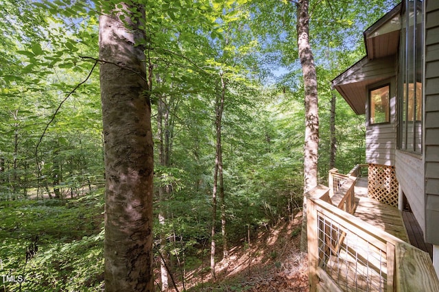 view of yard featuring a forest view