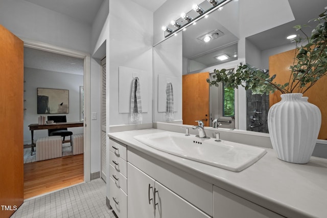 bathroom featuring vanity and tile patterned flooring