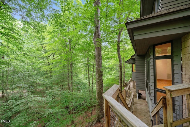 deck featuring a forest view