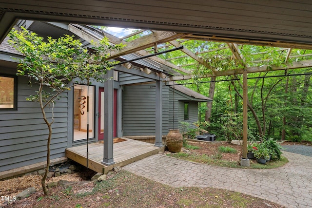 rear view of house featuring a pergola