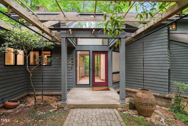 property entrance featuring french doors and a pergola