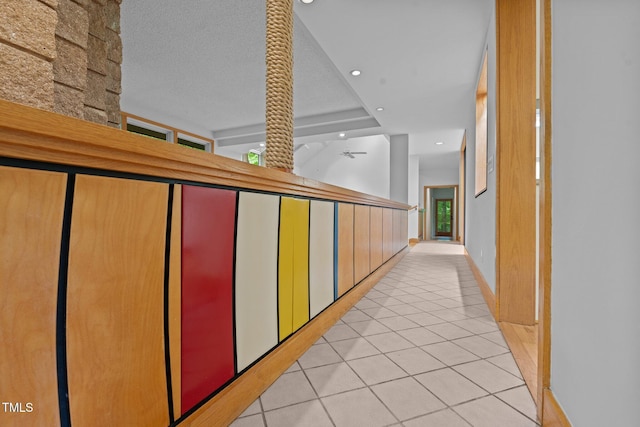 hallway with light tile patterned flooring, recessed lighting, and baseboards