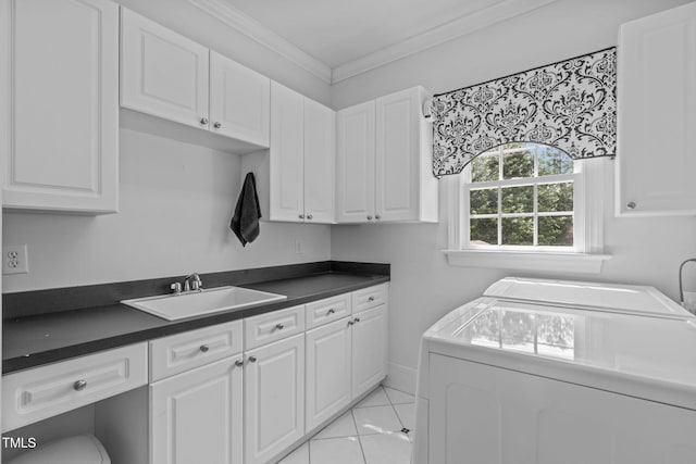 washroom with washer and clothes dryer, cabinet space, crown molding, and light tile patterned floors