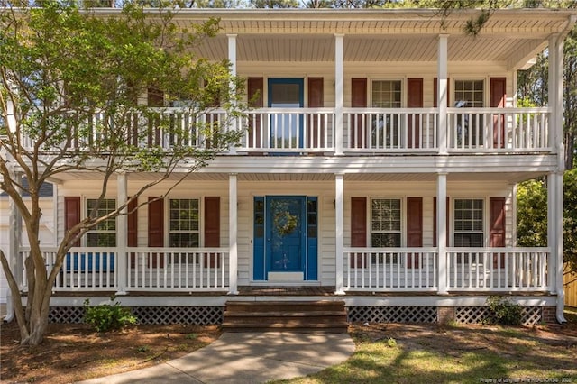 view of front facade with a porch and a balcony