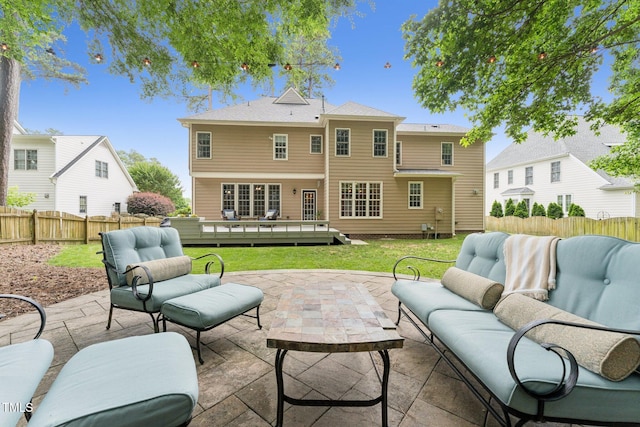 325 Wescott Ridge Dr, Holly Springs, NC 27540 - fenced backyard featuring an outdoor hangout area, a patio, and a deck
