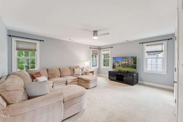 325 Wescott Ridge Dr, Holly Springs, NC 27540 - carpeted living area featuring healthy amount of natural light and a ceiling fan