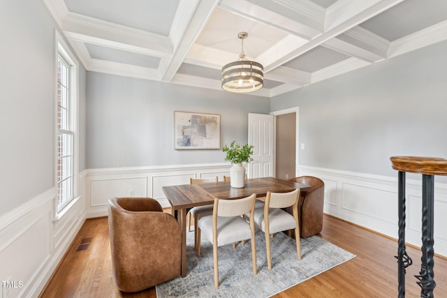 325 Wescott Ridge Dr, Holly Springs, NC 27540 - dining room with plenty of natural light, coffered ceiling, beamed ceiling, a chandelier, and wood finished floors