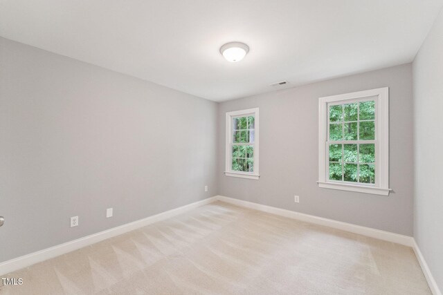 325 Wescott Ridge Dr, Holly Springs, NC 27540 - spare room featuring light colored carpet