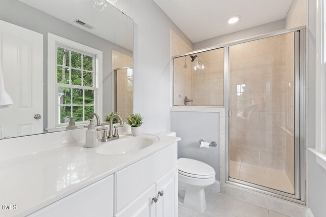 325 Wescott Ridge Dr, Holly Springs, NC 27540 - bathroom with vanity, tile patterned floors, and a shower stall
