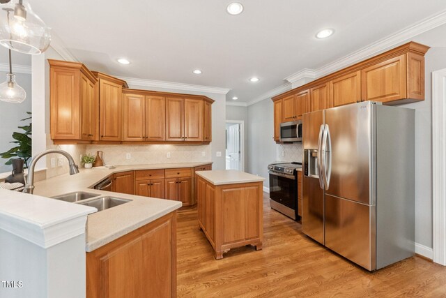 325 Wescott Ridge Dr, Holly Springs, NC 27540 - kitchen featuring appliances with stainless steel finishes, light countertops, recessed lighting, light wood-type flooring, and decorative backsplash