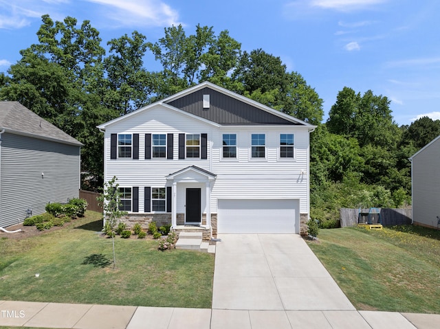view of front of property featuring a garage, driveway, and stone siding