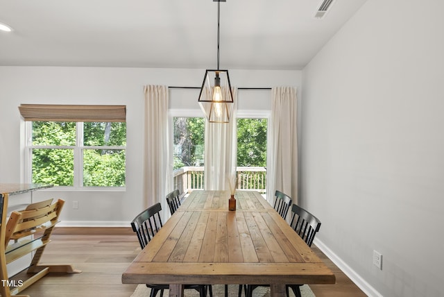 dining room with wood finished floors and baseboards