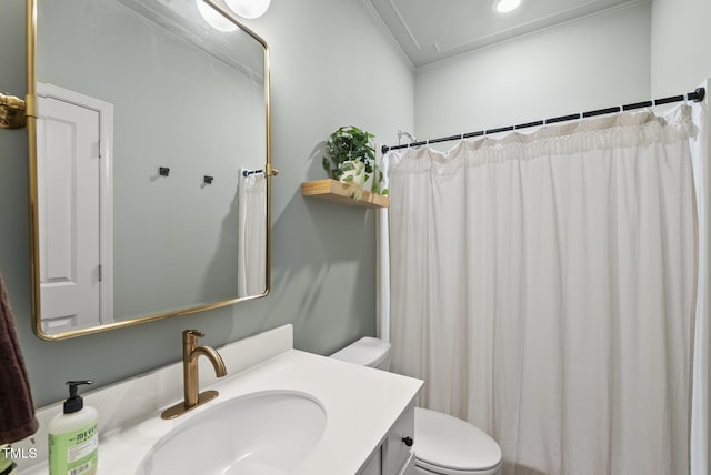 full bath featuring crown molding, toilet, and vanity