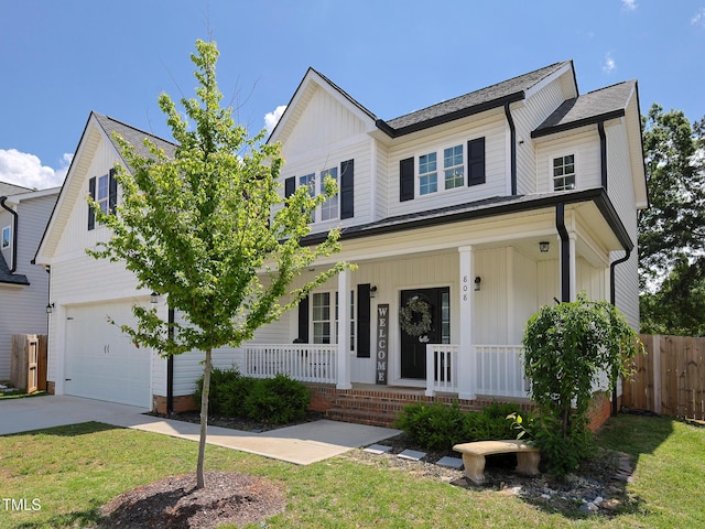 view of front of property with a porch, a garage, concrete driveway, and board and batten siding
