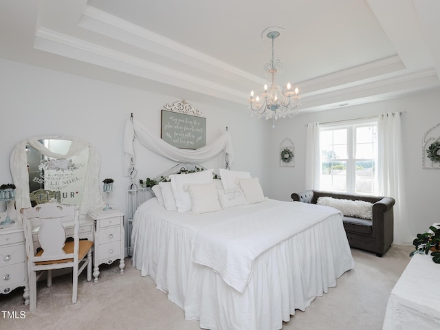 bedroom with a tray ceiling, light colored carpet, a chandelier, and crown molding