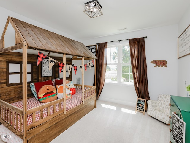 bedroom featuring carpet floors and baseboards