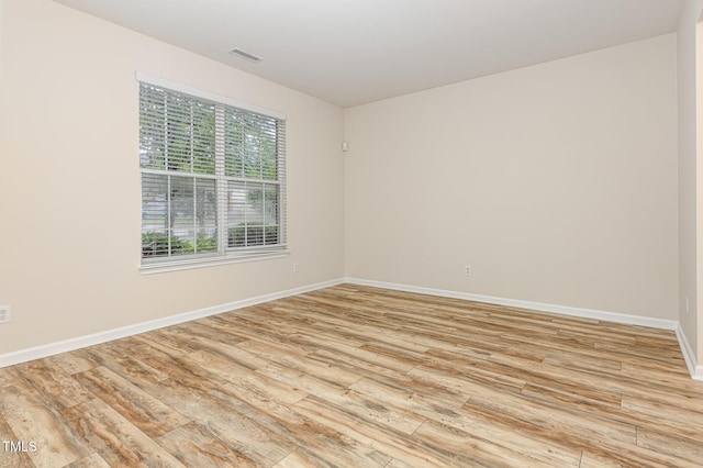12340 Tetons Ct, Durham, NC 27703 - empty room with light wood-type flooring and baseboards