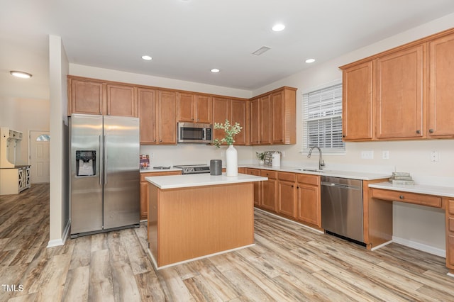 12340 Tetons Ct, Durham, NC 27703 - kitchen featuring stainless steel appliances, light wood finished floors, a kitchen island, light countertops, and recessed lighting
