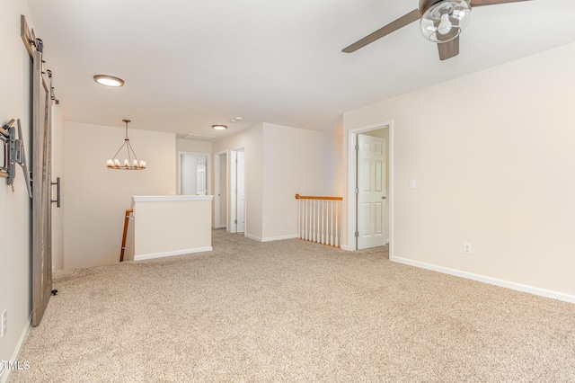 12340 Tetons Ct, Durham, NC 27703 - carpeted spare room with a barn door, recessed lighting, and ceiling fan