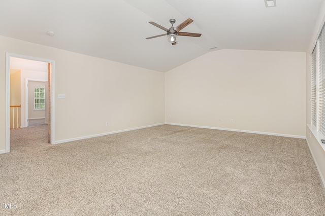 12340 Tetons Ct, Durham, NC 27703 - carpeted spare room with vaulted ceiling and a ceiling fan