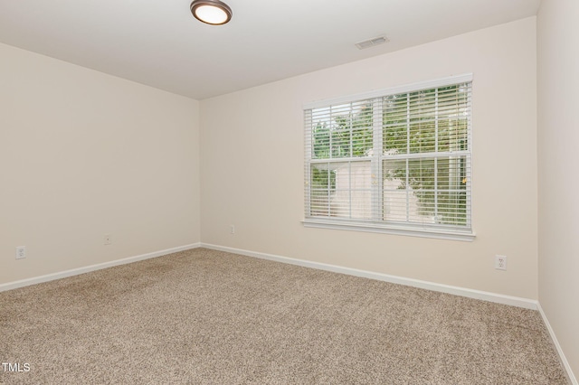 12340 Tetons Ct, Durham, NC 27703 - carpeted spare room featuring baseboards