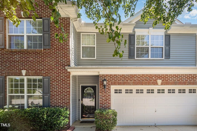 12340 Tetons Ct, Durham, NC 27703 - traditional-style home featuring brick siding, concrete driveway, and an attached garage