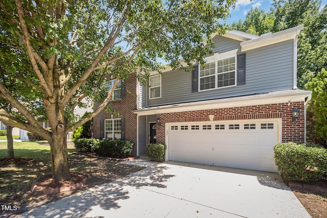 12340 Tetons Ct, Durham, NC 27703 - traditional-style house with concrete driveway, brick siding, and a garage