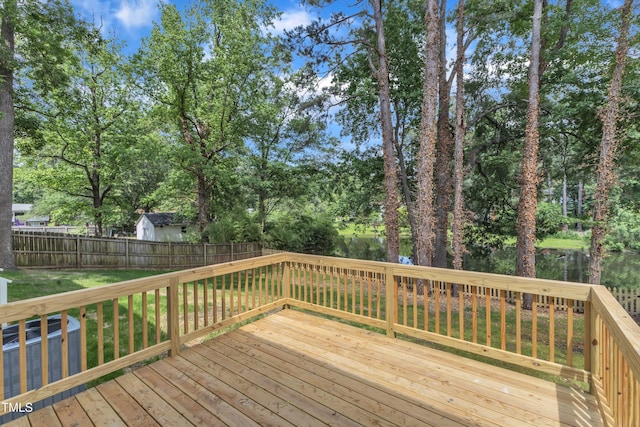wooden deck featuring view of scattered trees