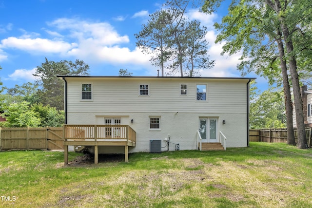 rear view of house featuring french doors, entry steps, brick siding, central AC unit, and a wooden deck