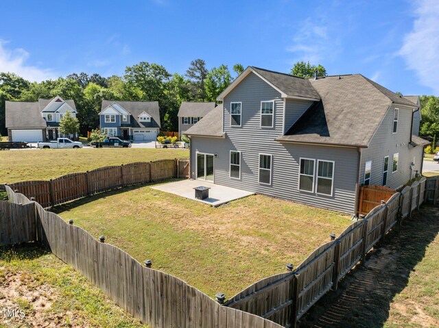 back of property featuring a patio, a residential view, and roof with shingles