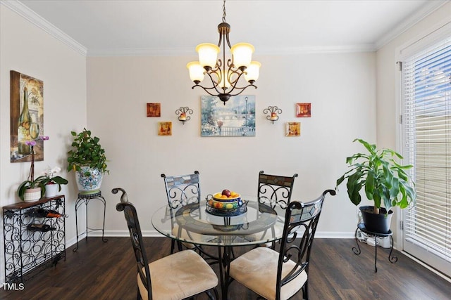 dining room with dark wood-style flooring, baseboards, a chandelier, and crown molding