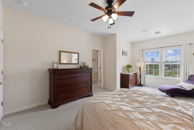carpeted bedroom with baseboards and a ceiling fan