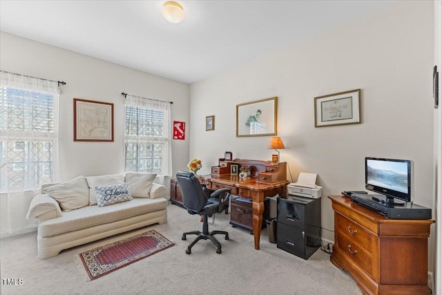 office featuring light carpet and baseboards