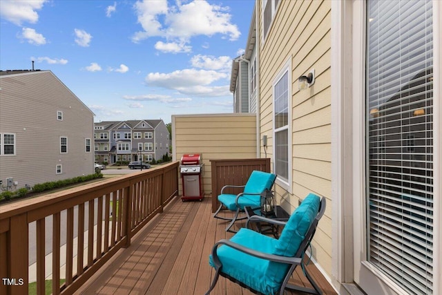 wooden terrace featuring a residential view