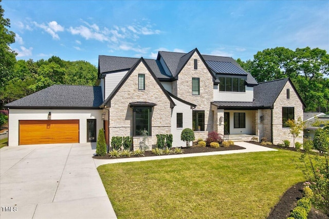 view of front of property with stone siding, concrete driveway, a front lawn, a standing seam roof, and an attached garage