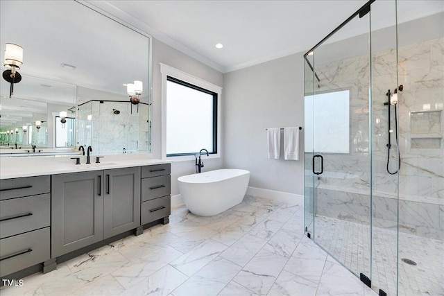 full bath featuring a marble finish shower, marble finish floors, vanity, ornamental molding, and a freestanding tub