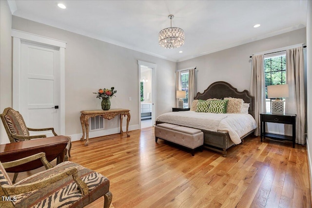bedroom with multiple windows, light wood-type flooring, a chandelier, crown molding, and baseboards