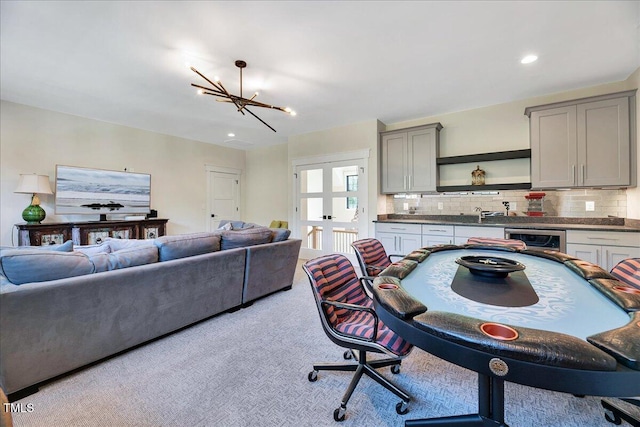 kitchen featuring open shelves, gray cabinets, open floor plan, dark countertops, and tasteful backsplash