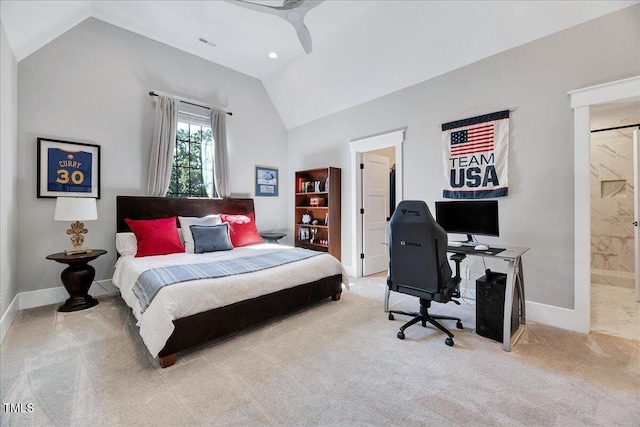 carpeted bedroom with lofted ceiling, a desk, baseboards, ceiling fan, and ensuite bathroom